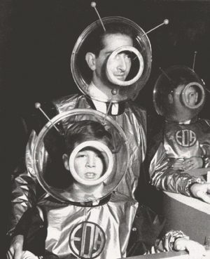 Vintage photo of a father and son dressed up in martian costumes